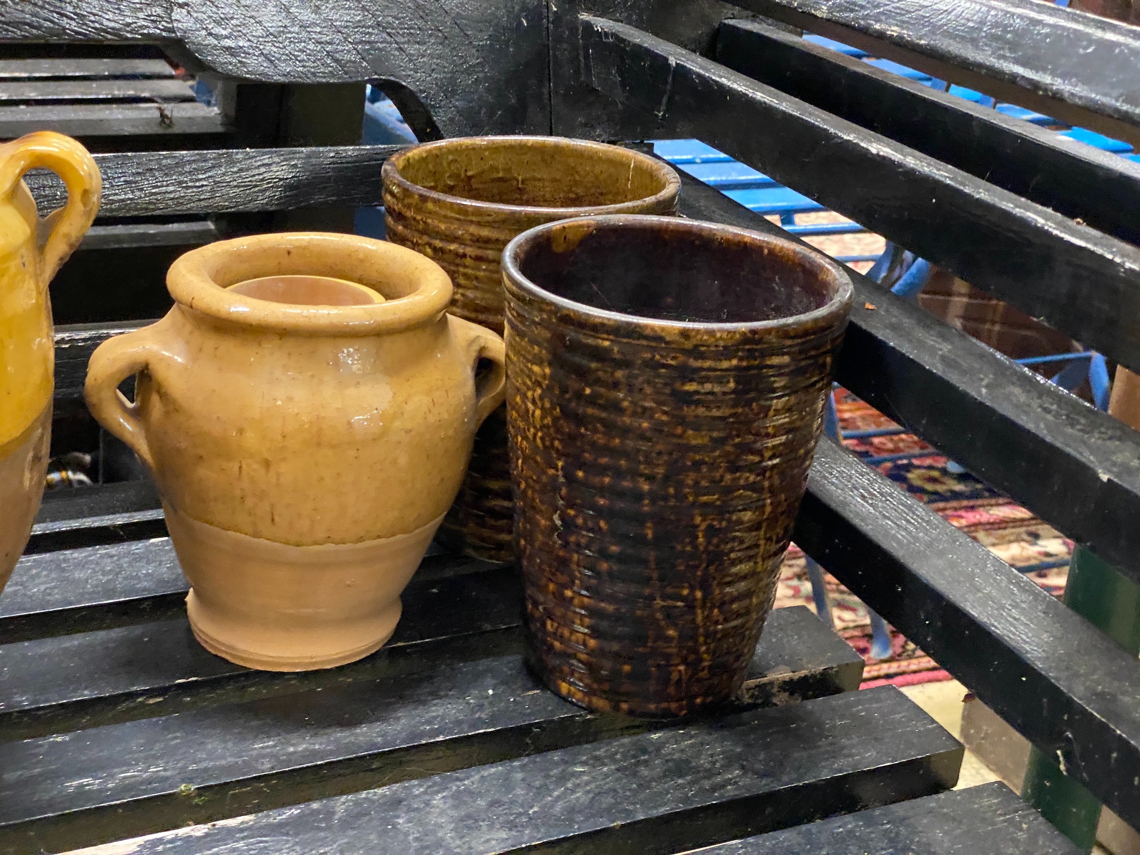 Twelve pieces of Continental glazed earthenware, largest 34cm, a bamboo vase, etc.